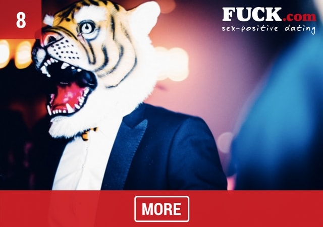 Man with tiger head mask. Popcorn.dating
