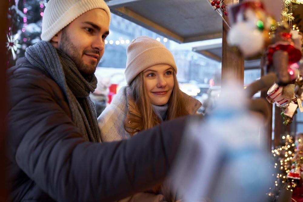 couple visiting a christmas market as a winter date