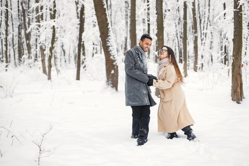 couple playing in the snow