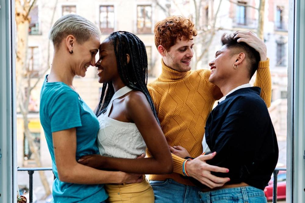 four polyamorous people in a relationships showing different types of relationships